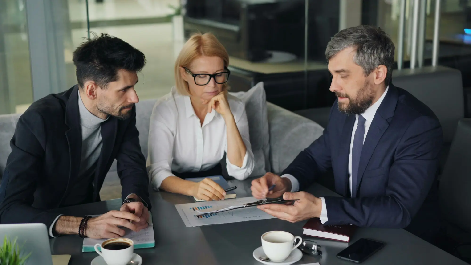 Accountant and business owners discussing a bank refinance