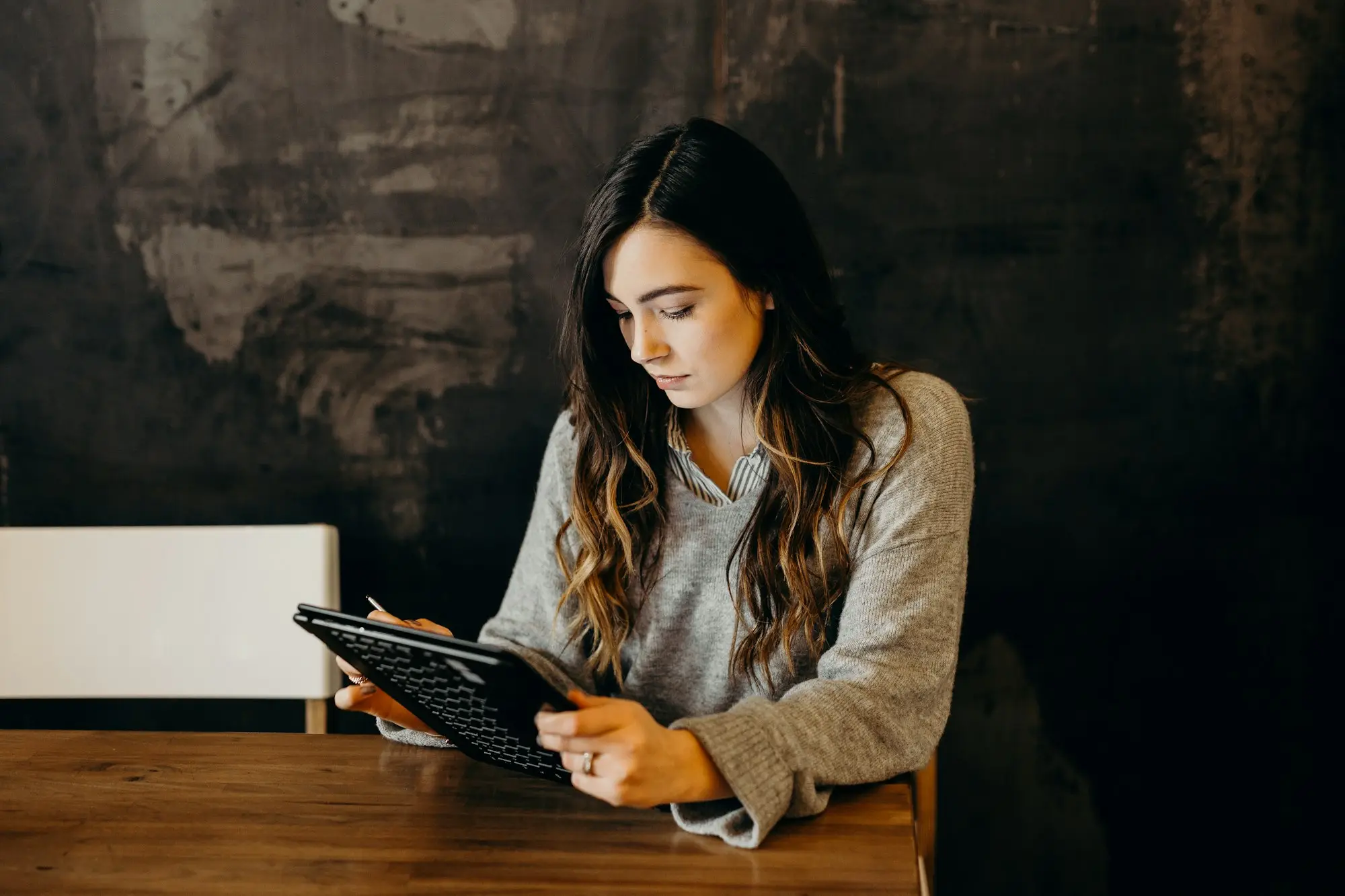 Cafe owner reviewing a short-term loan offer on a tablet