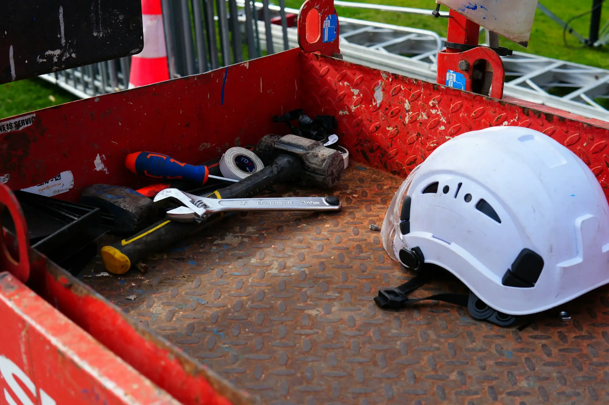 Tradie's tool tray with a hard hat and power tools